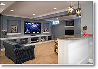 Cozy modern living room with a large TV and comfortable seating.