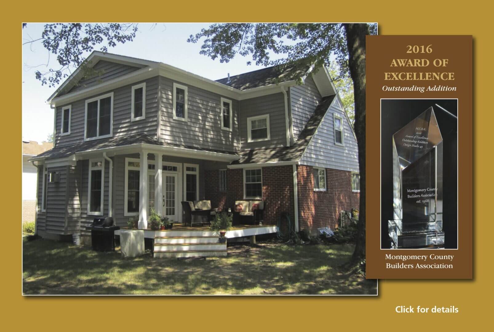 A charming two-story house with a spacious porch and lush green lawn under tall trees.