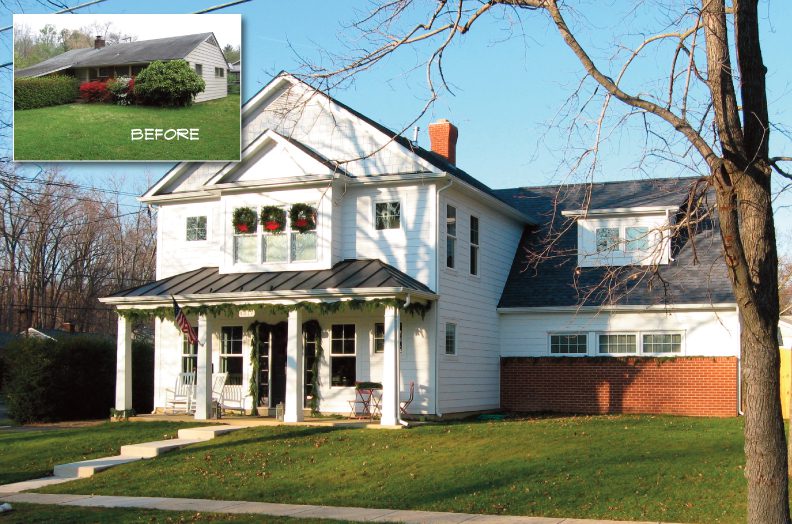 A large white house with a porch and green lawn under a clear blue sky.