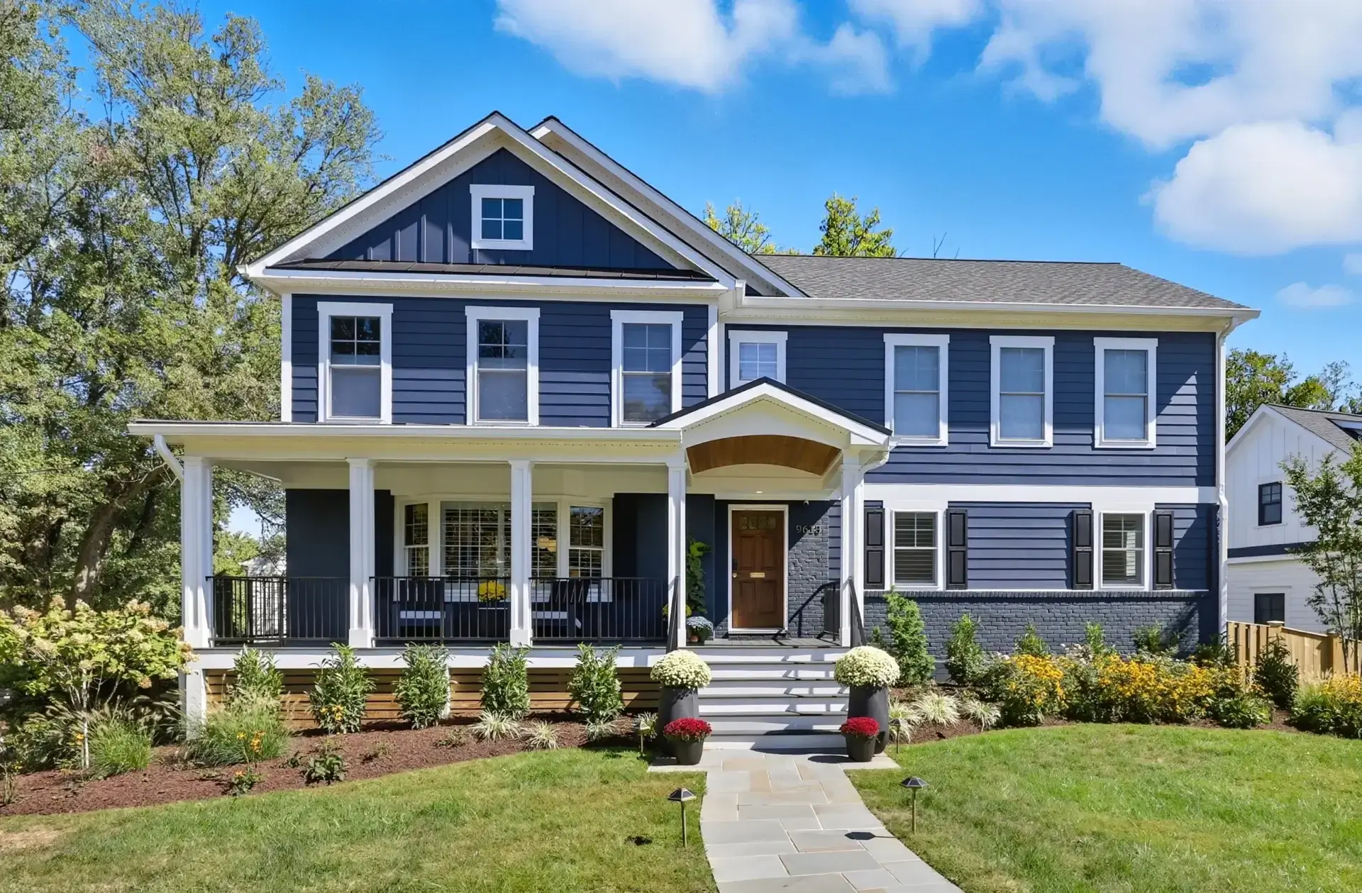 Blue two-story house with front porch
