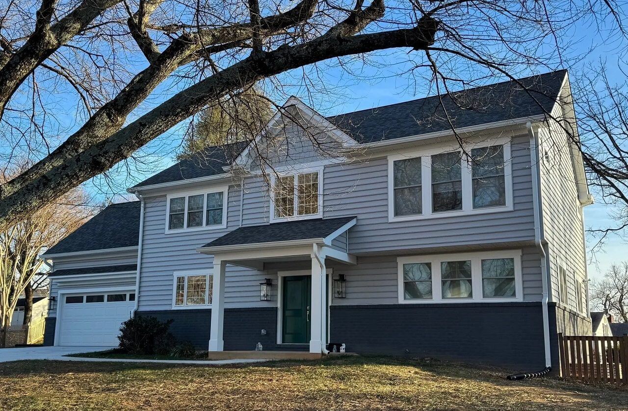 Two story gray house with front porch