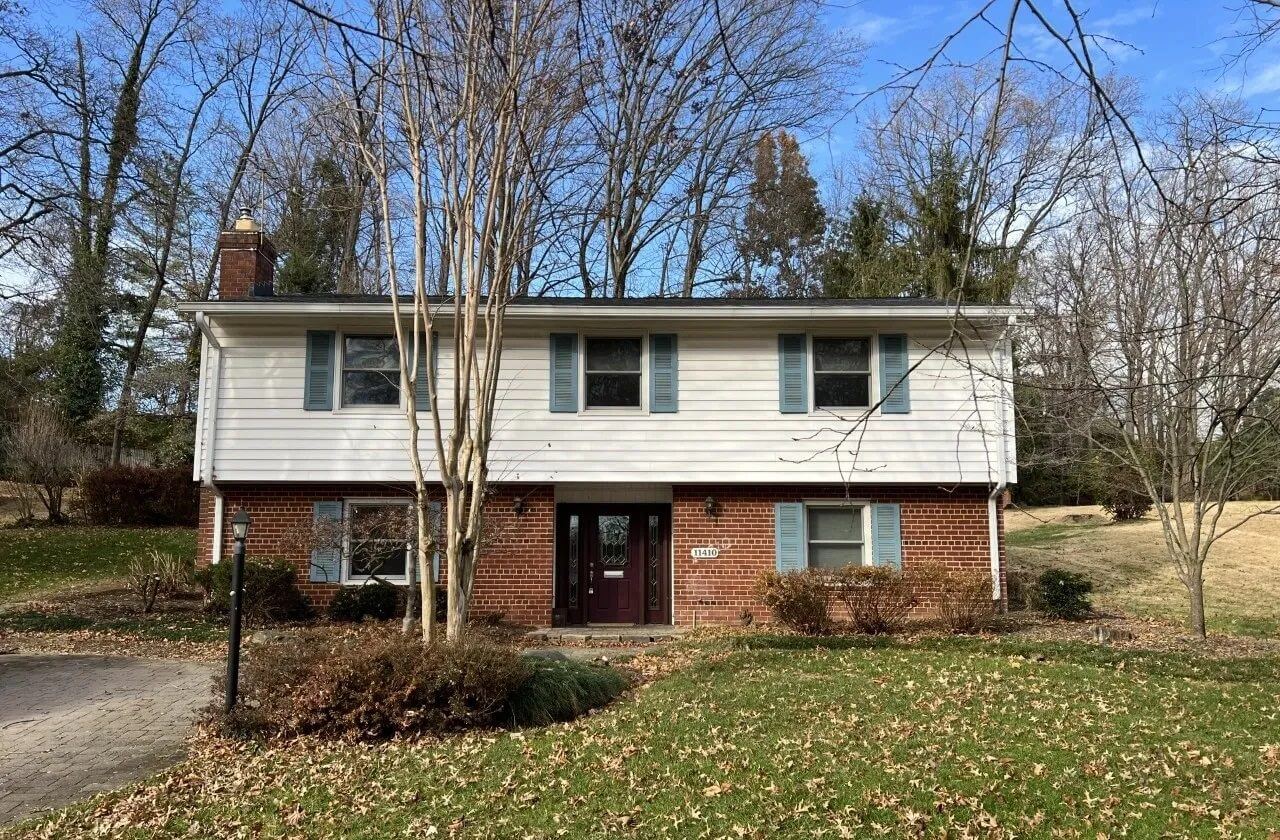 Brick split-level house with blue shutters